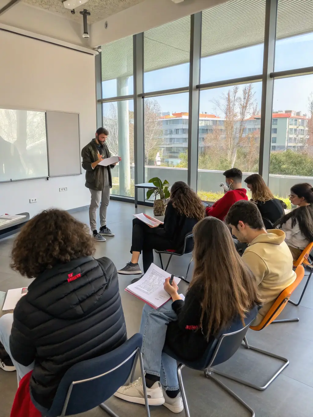 A captivating image of a workshop where participants are learning about filmmaking or writing adventure stories, led by experienced professionals.